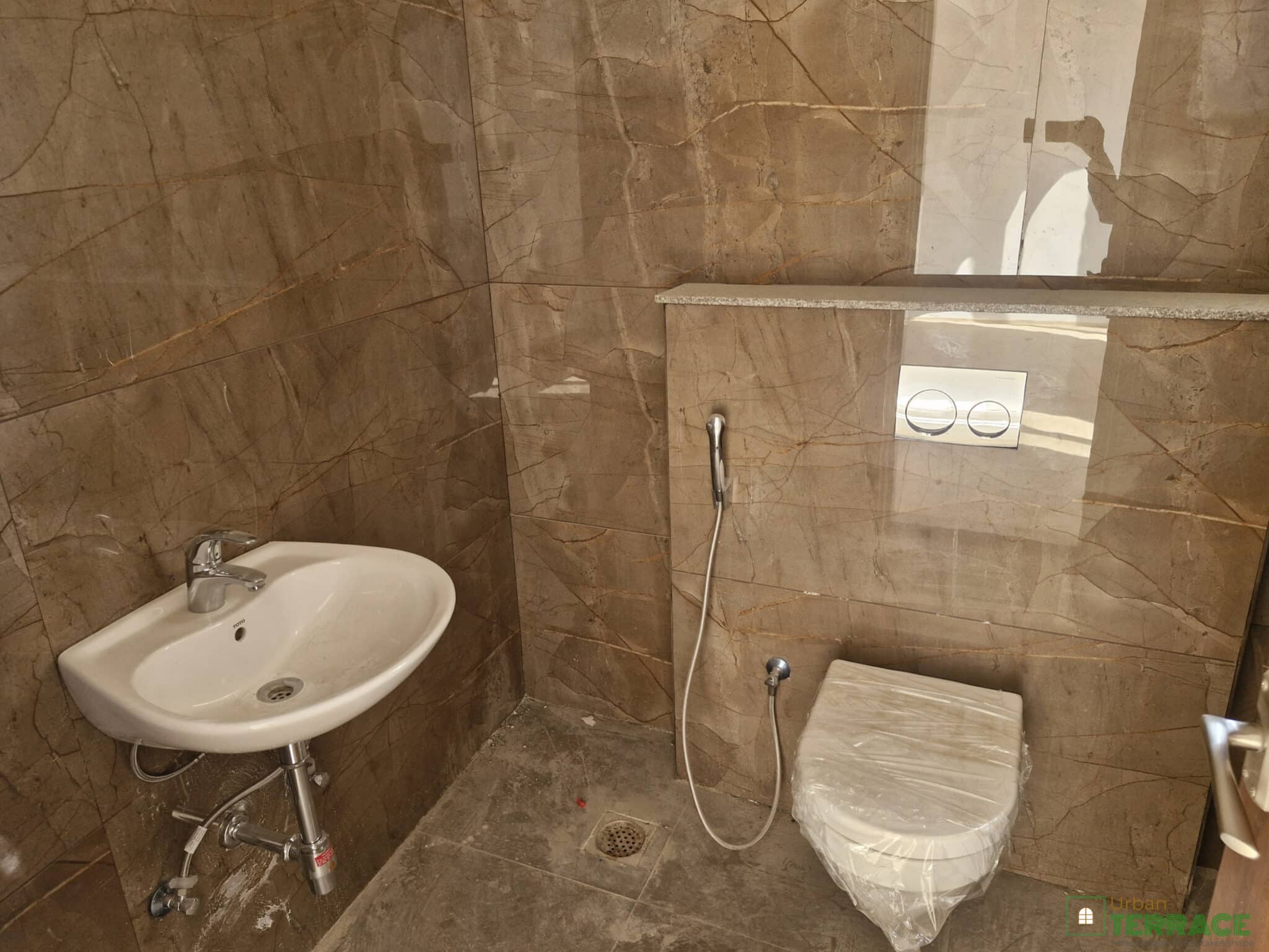 washroom 1 of 4bhk flat for sale at race course road by urban terrace